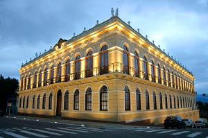 a large building is lit up at night at Space Universe Pinda, Taubaté, Aparecida, Campos do Jordāo in Pindamonhangaba