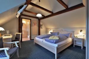 Rúm í herbergi á Hammermühle Hotel & Gesundheitsresort +37 myndir