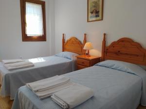 Postel nebo postele na pokoji v ubytování Apartamentos Ball Benas Edificio Mirador