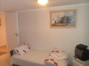 A bed or beds in a room at Micófogadó