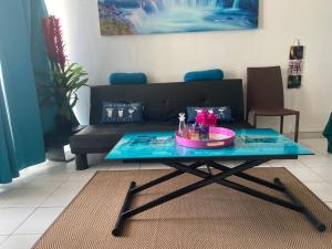 Istumisnurk majutusasutuses STUDIO ACACIA 3 ILETS PIEDS DANS L EAU et PISCINE