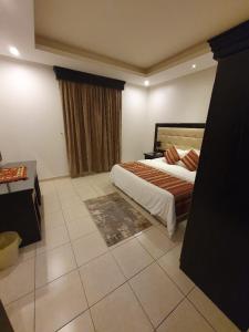 Cama o camas de una habitación en Katara Hotel Apartment