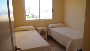 Postel nebo postele na pokoji v ubytování Marina Azul ElConserje + 8 fotografií