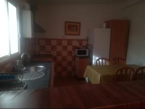 Kuchnia lub aneks kuchenny w obiekcie TIO TESORO