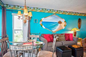 a living room with a couch and a table at 505 - Gulf Strand in St. Pete Beach