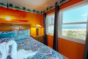 a bedroom with a bed and a window at 505 - Gulf Strand in St Pete Beach