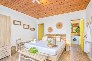 Postel nebo postele na pokoji v ubytování Créole Bay - Suites and Spa