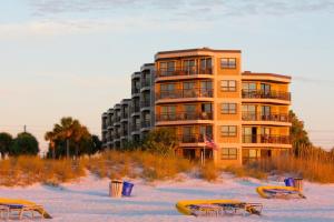 a building on the beach with tables and chairs at 505 - Gulf Strand in St. Pete Beach