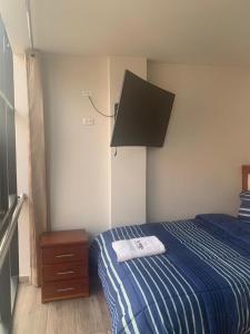 A-Hope Suite Hotel客房内的一张或多张床位