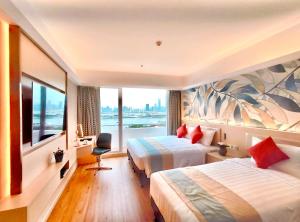 Voodi või voodid majutusasutuse Hotel Riviera Macau toas