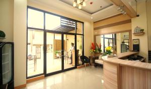 a living room with a large sliding glass door at Anri Pension House in Cebu City