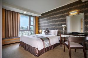Postel nebo postele na pokoji v ubytování Zhong Ke Hotel