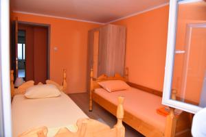 Postel nebo postele na pokoji v ubytování Apartman Stevanovic