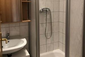 a bathroom with a shower and a sink at Ferienwohnung in Zwickau in Zwickau