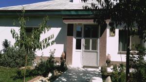 a white house with a white door at Otopeni Airport Apartment in Otopeni