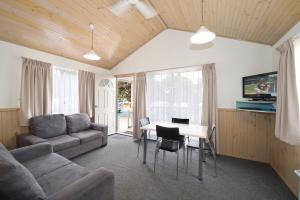 a living room with a couch and a table at BIG4 Breeze Holiday Parks - Port Hughes in Port Hughes