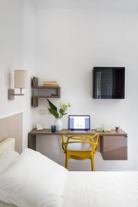 TV a/nebo společenská místnost v ubytování San Leonardo Suites