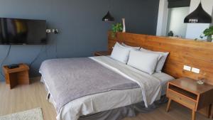 Łóżko lub łóżka w pokoju w obiekcie Kenting Cozy B&B