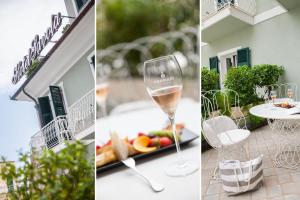 kieliszek wina na stole z talerzem owoców w obiekcie Hotel Savoia w Alassio