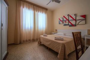 Postel nebo postele na pokoji v ubytování Hotel Sabatino