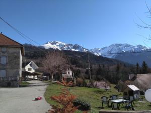 a view of a village with mountains in the background at Auberge du Grand Joly in Sainte-Agnès