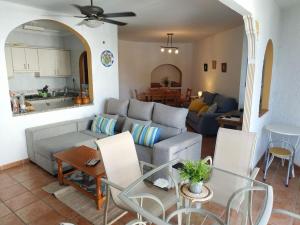 a living room with a couch and a table at CARABEO I 18 MENYBER in Nerja