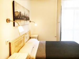 Posteľ alebo postele v izbe v ubytovaní Hostal Portugal