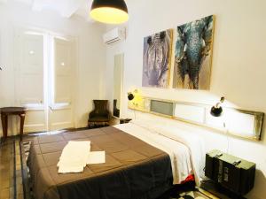 Posteľ alebo postele v izbe v ubytovaní Hostal Portugal