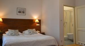 Posteľ alebo postele v izbe v ubytovaní Hotel Polonia