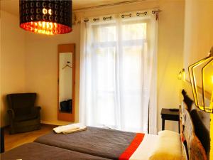 Posteľ alebo postele v izbe v ubytovaní Hostal Portugal