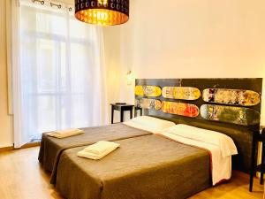 Posteľ alebo postele v izbe v ubytovaní Hostal Portugal