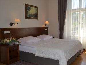 Posteľ alebo postele v izbe v ubytovaní Hotel Polonia
