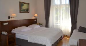Posteľ alebo postele v izbe v ubytovaní Hotel Polonia