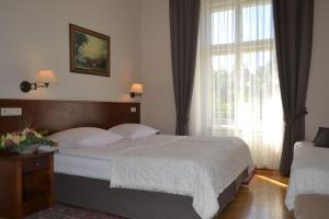 Posteľ alebo postele v izbe v ubytovaní Hotel Polonia
