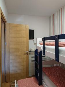 Krevet ili kreveti na kat u jedinici u objektu Apartman Relax Lux - Vila Peković