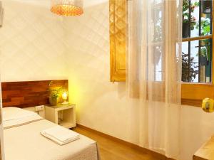 Posteľ alebo postele v izbe v ubytovaní Hostal Portugal