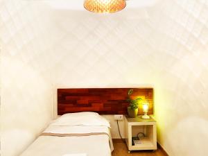 Posteľ alebo postele v izbe v ubytovaní Hostal Portugal