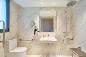 a bathroom with a sink and a toilet and a shower at Eurostars Astoria in Málaga