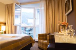Postel nebo postele na pokoji v ubytování Hotel Stadt Kufstein + 37 fotografií