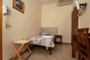 Postel nebo postele na pokoji v ubytování Hotel Sabatino