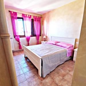 Ένα ή περισσότερα κρεβάτια σε δωμάτιο στο Villa La Terrazza