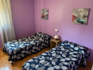 Postel nebo postele na pokoji v ubytování Hostal Expo
