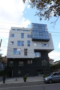 a building with a lot of solar panels on it at Glass Cube Hotel in Chişinău