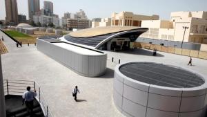 a group of people walking around a building at Deira Partition room in Dubai