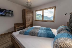 Posteľ alebo postele v izbe v ubytovaní Montepart Zillertal