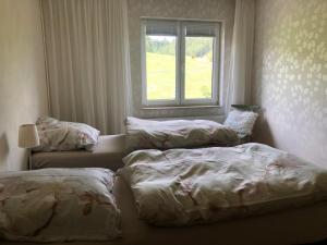 Postel nebo postele na pokoji v ubytování Familienpension Obere Juchhe, Ferienwohnung und Zimmer
