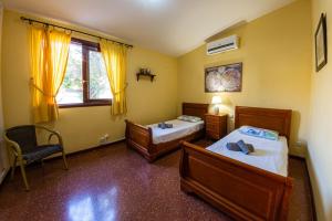 Posteľ alebo postele v izbe v ubytovaní Villa Punta Negra HEATED POOL tenerifesummervillas + 26 fotografií