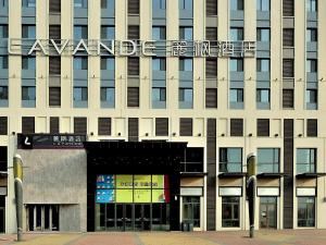 a building with a sign on the side of it at Lavande Hotel (Siping Wanda Plaza Branch) in Siping