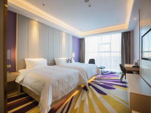 Postel nebo postele na pokoji v ubytování Lavande Hotel (Datong dongxin Plaza Branch)