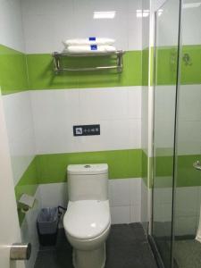 a bathroom with a toilet with green and white stripes at 7Days Inn Qiongzhong Zero Kilometer in Qiongzhong